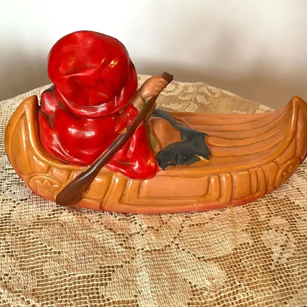 Rare 1920's Antique celluloid toy girl in a canoe; don't miss her!